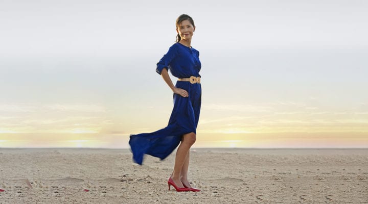 Stephanie Cheng stands on a beach