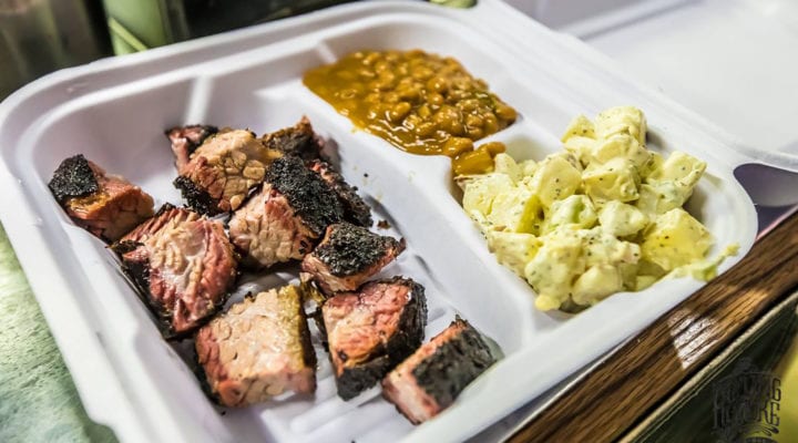 To-go container of meat, beans and potato salad